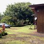 From the back corner of the lot, looking towards the driveway and front.